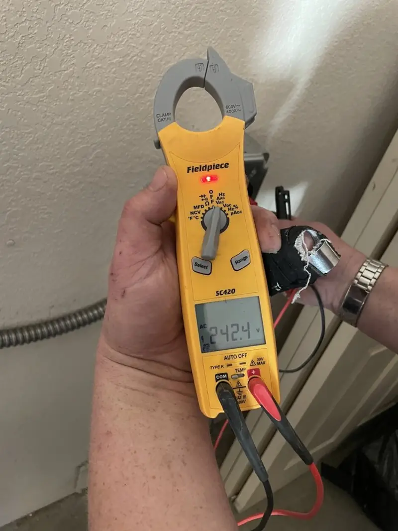 Voltage testing with clamp meter during Ceiling Fan Installation in Naples